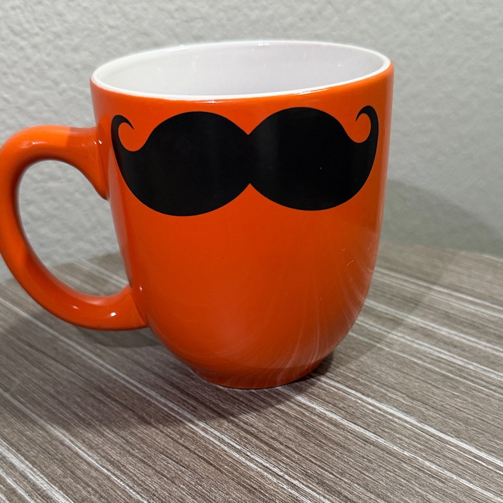 Orange Mug with Black Mustache Design